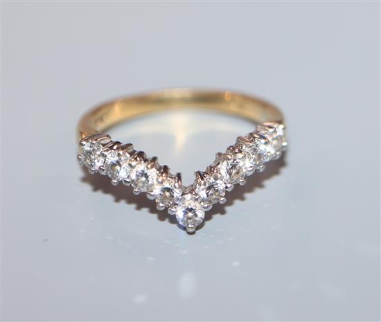 An 18ct gold nine-stone diamond V shaped ring, size H/I.